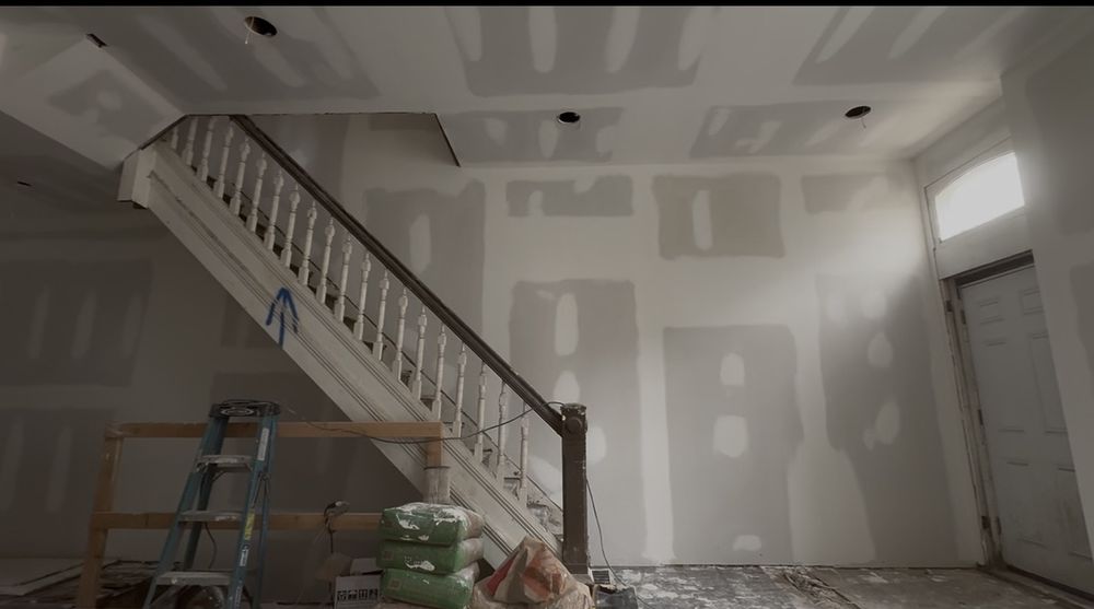 Drywall hung and finished, original staircase preserved
